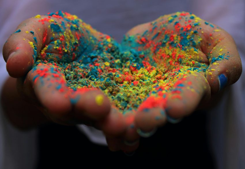Photo by Nandhu Kumar: https://www.pexels.com/photo/hands-covered-in-colored-powder-3899269/ - Holi Travel